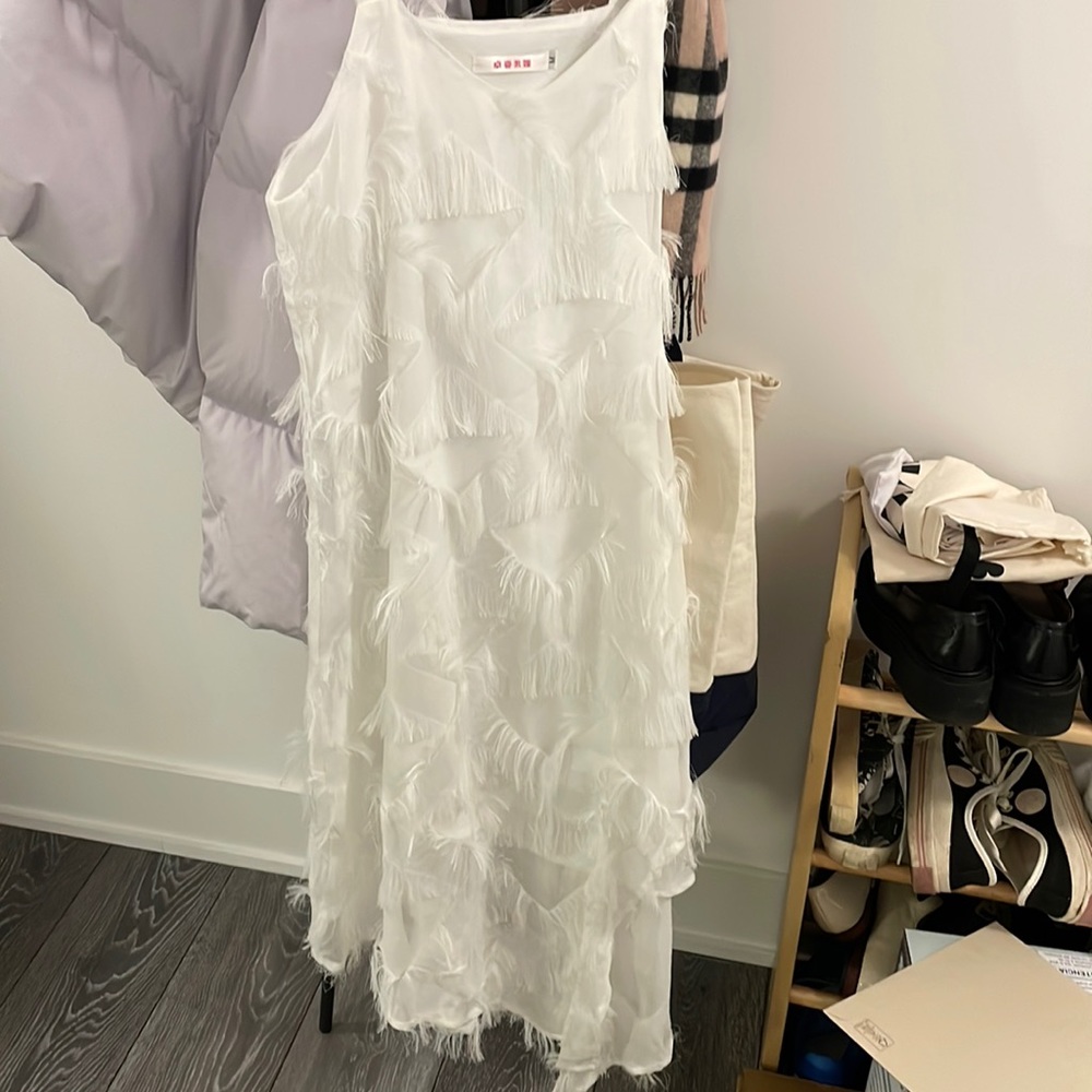 Flowy dress with feather detail